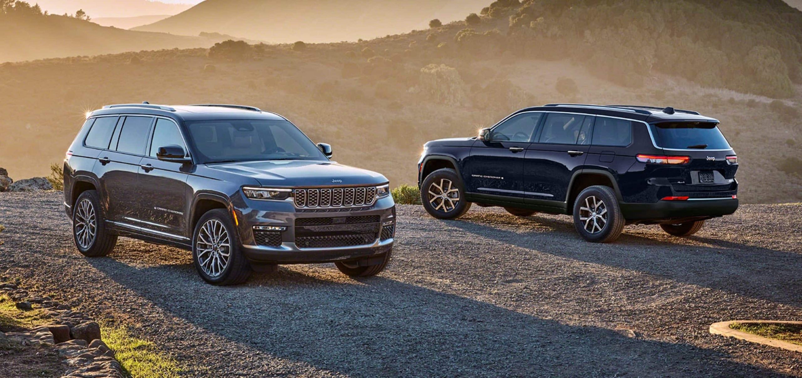 A pair of parked 2025 Jeep Grand Cherokee financed models
